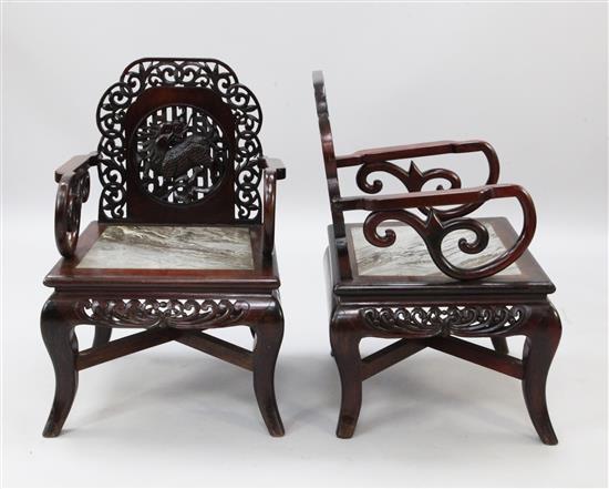 A pair of Chinese hardwood elbow chairs, H.2ft 9in.